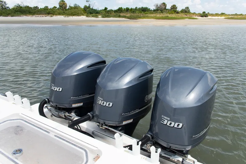  Yacht Photos Pics 2015 Invincible 36 Open Fisherman with triple Yamaha 300 outboard engines on calm water.