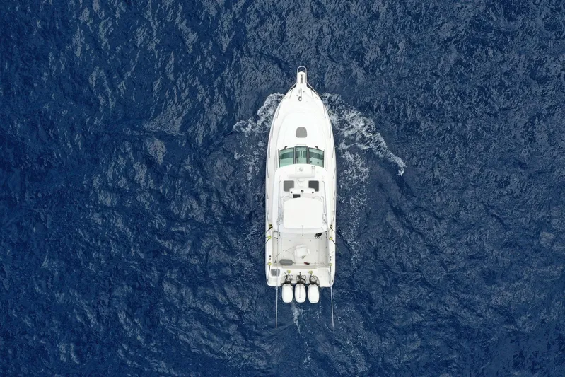  Yacht Photos Pics Aerial view of 2018 Boston Whaler 345 Conquest boat cruising on open ocean.