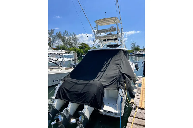  Yacht Photos Pics 2018 Boston Whaler 345 Conquest boat docked, covered, with dual outboard motors.