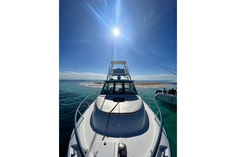  Yacht Photos Pics 2018 Boston Whaler 345 Conquest on clear blue water under bright sun.