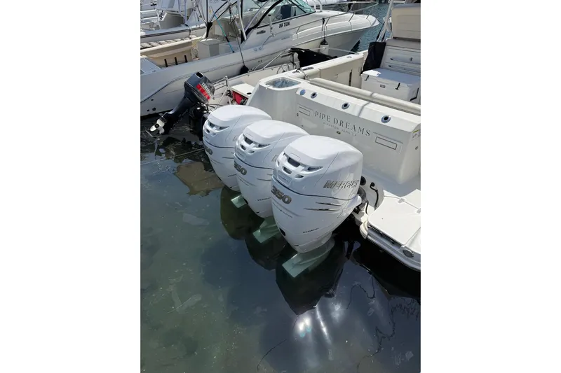  Yacht Photos Pics 2018 Boston Whaler 345 Conquest with triple Mercury outboard engines docked in marina.