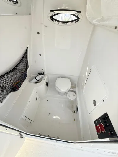  Yacht Photos Pics 2018 Sea Hunt Gamefish 30 boat interior with toilet and storage compartments.