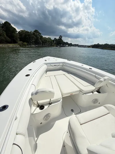  Yacht Photos Pics 2018 Sea Hunt Gamefish 30 boat with forward seating on a calm waterway.