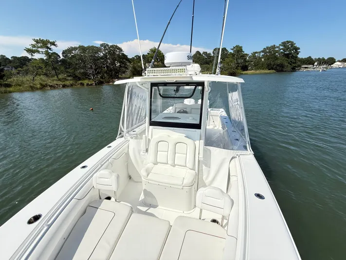 Yacht Photos Pics 2018 Sea Hunt Gamefish 30 boat with forward seating on calm water.