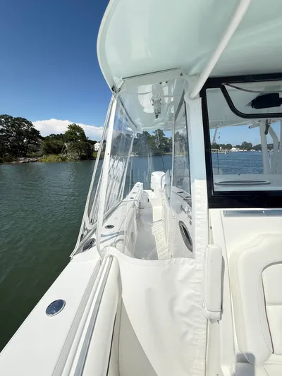  Yacht Photos Pics 2018 Sea Hunt Gamefish 30 boat with forward seating, docked on a sunny day.