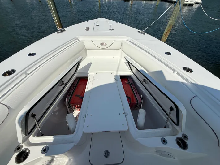  Yacht Photos Pics 2018 Sea Hunt Gamefish 30 Forward Seating with open storage compartments on a sunny day.