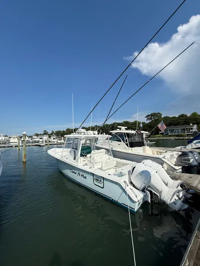  Yacht Photos Pics 2018 Sea Hunt Gamefish 30 boat docked, featuring forward seating and fishing rods.