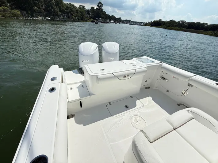  Yacht Photos Pics 2018 Sea Hunt Gamefish 30 boat with forward seating on a calm river.