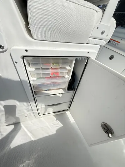  Yacht Photos Pics 2018 Sea Hunt Gamefish 30 storage compartment with organized tackle boxes.