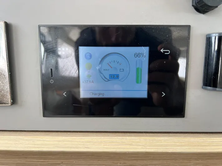 Roxie Yacht Photos Pics Control panel display on 2024 Lagoon 42 showing battery charge status at 66%.