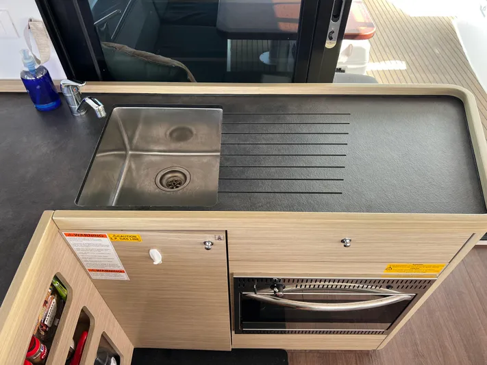 Roxie Yacht Photos Pics Modern kitchen sink and counter in 2024 Lagoon 42 yacht interior.