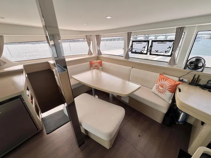 Roxie Yacht Photos Pics 2024 Lagoon 42 catamaran interior with modern seating and panoramic windows.