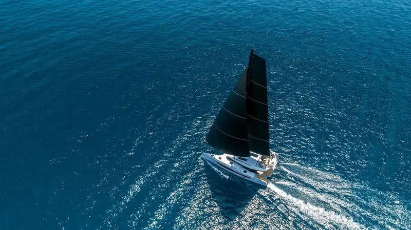  Yacht Photos Pics Aerial view of 2026 McConaghy MC55 sailing on open blue sea.