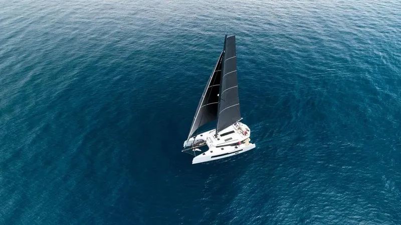  Yacht Photos Pics Aerial view of 2026 McConaghy MC55 sailing on open blue ocean.