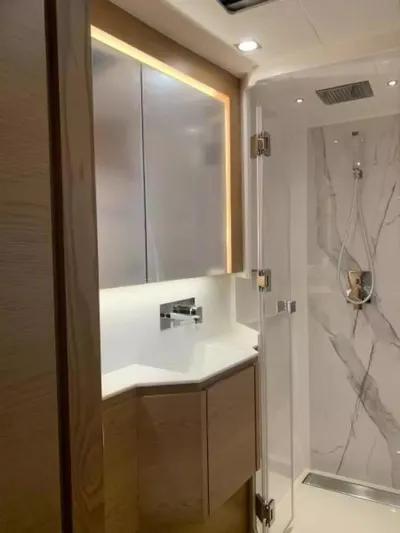  Yacht Photos Pics Luxurious bathroom interior of 2026 McConaghy MC55 yacht with modern fixtures and marble accents.