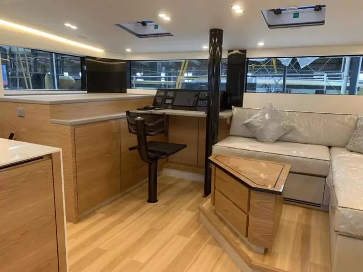  Yacht Photos Pics Luxurious interior of 2026 McConaghy MC55 yacht with modern design and comfortable seating.