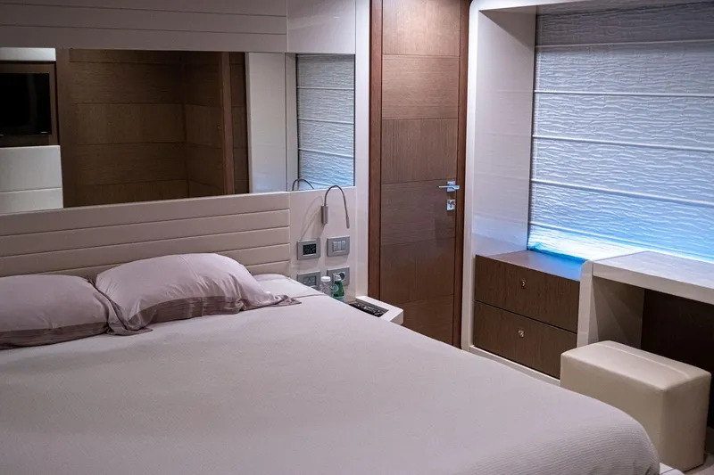  Yacht Photos Pics Luxurious bedroom interior on 2013 Ferretti Yachts 870, featuring modern design and elegant furnishings.