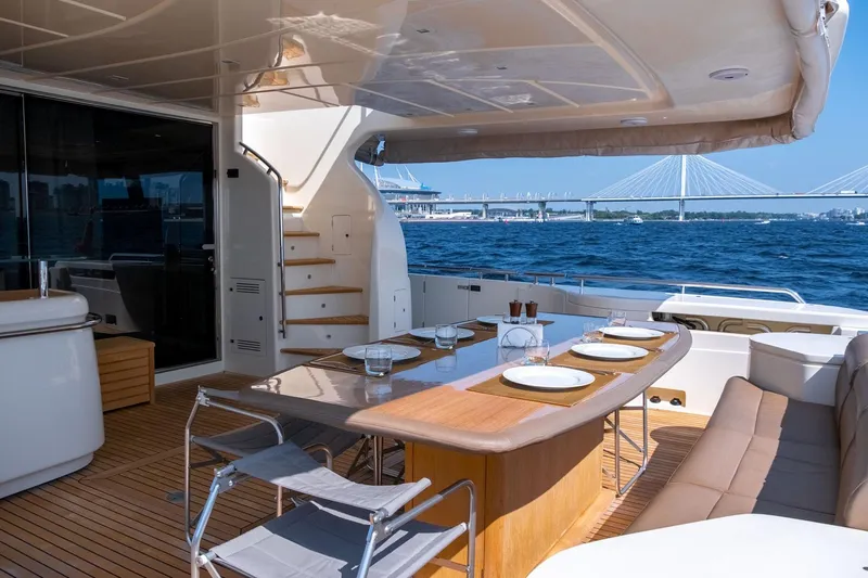  Yacht Photos Pics Luxurious 2013 Ferretti Yachts 870 with elegant outdoor dining area and scenic ocean view.