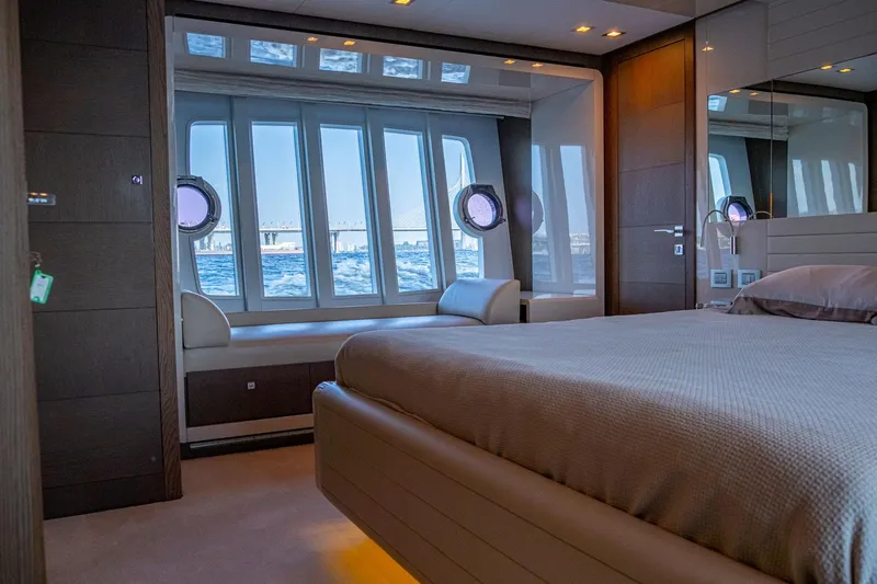  Yacht Photos Pics Luxurious bedroom interior of 2013 Ferretti Yachts 870 with ocean view windows.