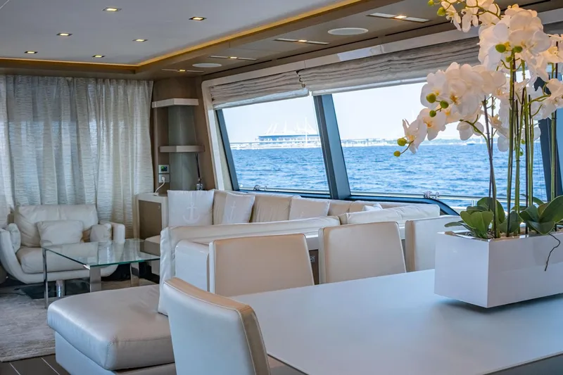  Yacht Photos Pics Luxurious interior of 2013 Ferretti Yachts 870 with ocean view and elegant white furnishings.
