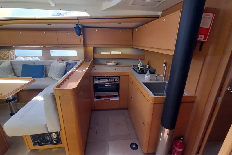 Southern Cross Yacht Photos Pics Luxurious interior of 2015 Dufour 560 Grand Large yacht with modern kitchen and seating area.