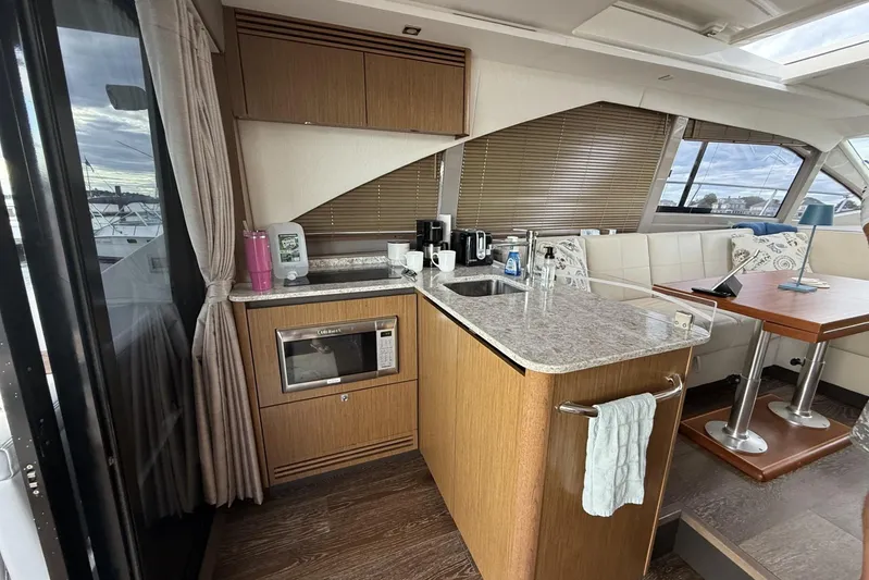  Yacht Photos Pics Interior of 2018 Sea Ray Sundancer 460 yacht with modern kitchen and dining area.