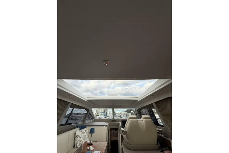  Yacht Photos Pics Interior view of 2018 Sea Ray Sundancer 460 yacht with skylight and seating area.
