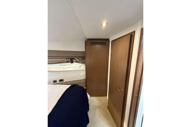  Yacht Photos Pics Interior cabin of 2018 Sea Ray Sundancer 460 yacht, featuring wood paneling and modern design.