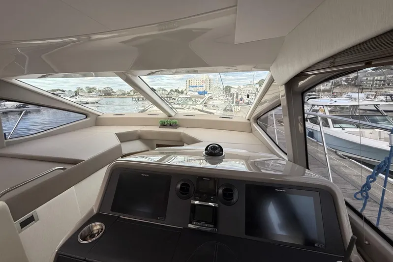  Yacht Photos Pics 2018 Sea Ray Sundancer 460 yacht interior with modern navigation system and panoramic windows.