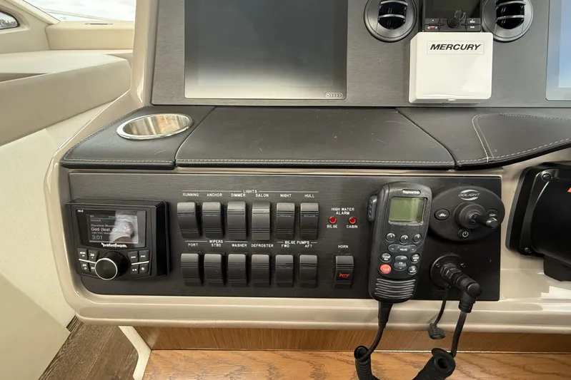  Yacht Photos Pics Control panel of a 2018 Sea Ray Sundancer 460 yacht with navigation and communication equipment.