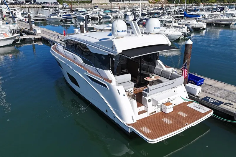  Yacht Photos Pics 2018 Sea Ray Sundancer 460 yacht docked at marina, featuring sleek design and spacious deck.
