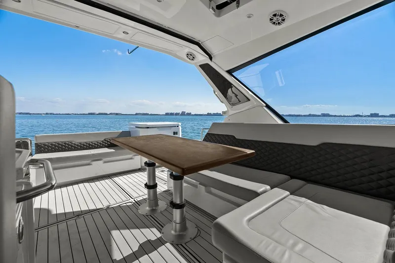  Yacht Photos Pics Luxurious interior of 2020 Aquila 36 yacht with ocean view and elegant seating.