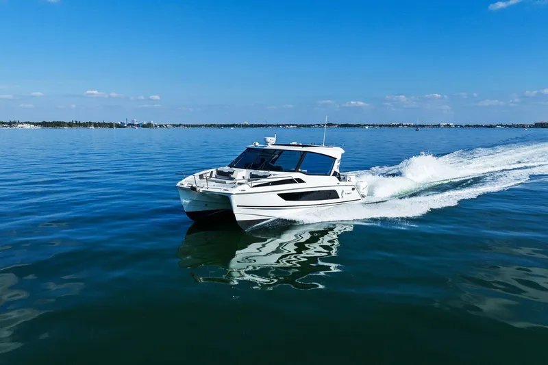  Yacht Photos Pics Aquila 36 boat cruising on calm blue waters, 2020 model.