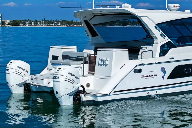  Yacht Photos Pics 2020 Aquila 36 boat with twin Mercury engines on calm water.