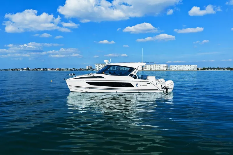  Yacht Photos Pics Aquila 36 boat on calm water under a clear blue sky, 2020 model.