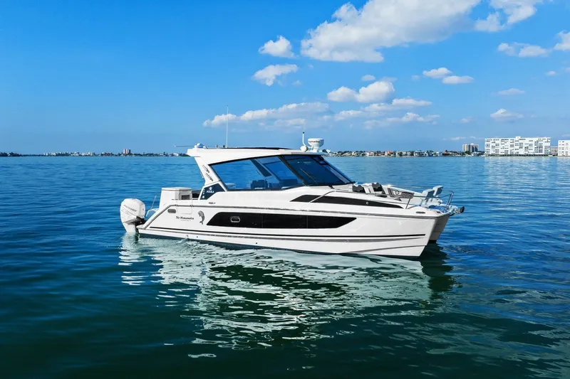  Yacht Photos Pics Aquila 36 boat from 2020 on calm blue water under a clear sky.