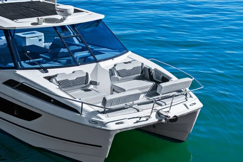  Yacht Photos Pics Aquila 36 boat, 2020 model, with sleek design and spacious seating on blue water.