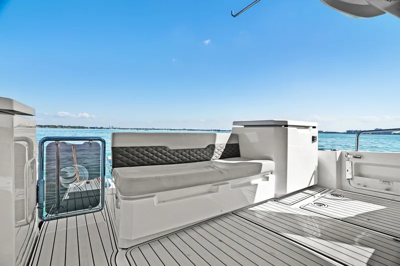  Yacht Photos Pics Aquila 36 yacht deck with seating, overlooking serene blue waters, 2020 model.