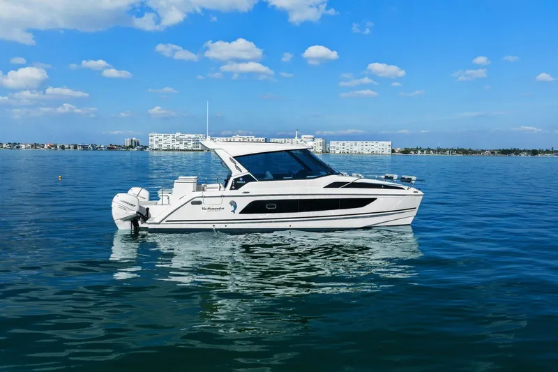  Yacht Photos Pics Aquila 36 boat from 2020 on calm blue water under a clear sky.