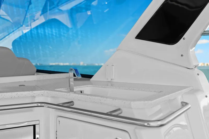  Yacht Photos Pics Luxury yacht interior with sleek countertop and faucet, Aquila 36, 2020 model.