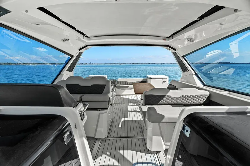  Yacht Photos Pics Interior view of 2020 Aquila 36 yacht with spacious seating and ocean backdrop.