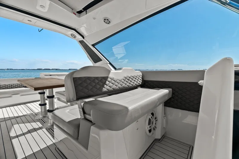  Yacht Photos Pics Interior of 2020 Aquila 36 yacht with elegant seating and ocean view.