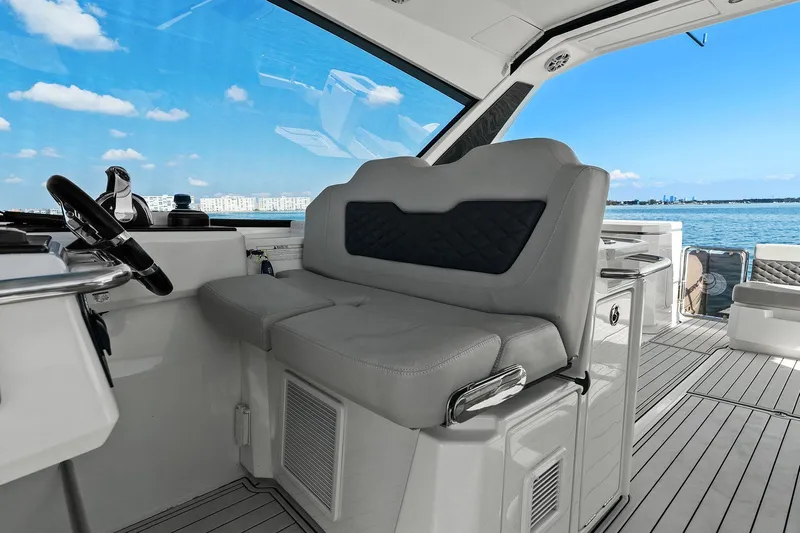  Yacht Photos Pics Helm of 2020 Aquila 36 boat with luxurious seating and ocean view.