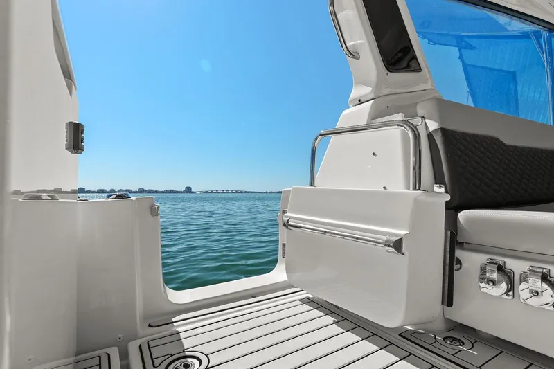  Yacht Photos Pics Aquila 36 boat interior with ocean view, 2020 model, featuring sleek design and comfortable seating.