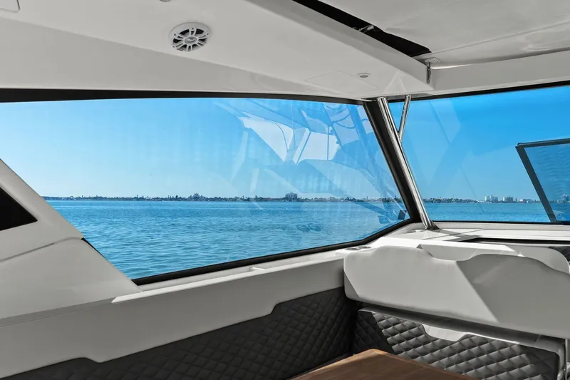  Yacht Photos Pics Interior view from 2020 Aquila 36 yacht, showcasing panoramic ocean scenery through large windows.