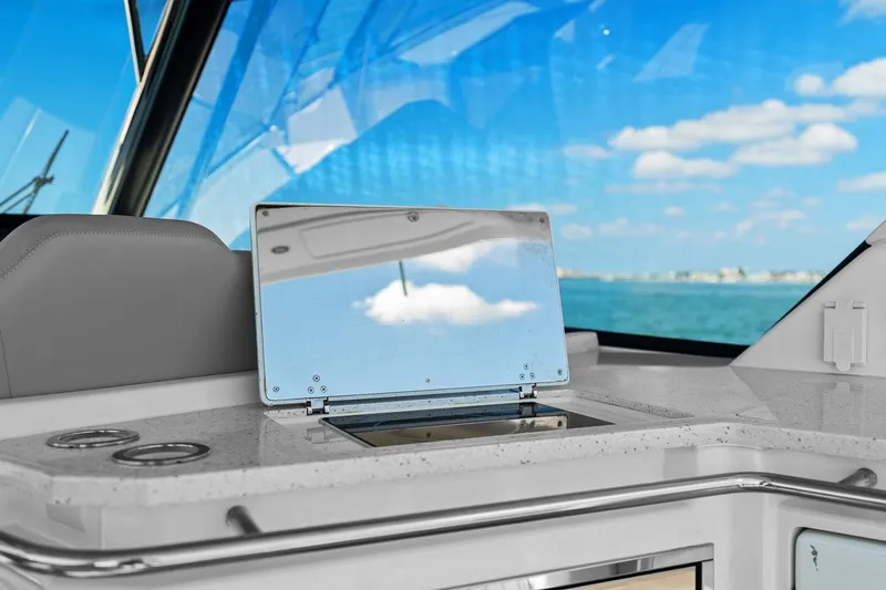  Yacht Photos Pics Aquila 36 yacht interior with ocean view, featuring sleek countertop and reflective panel.