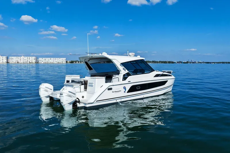  Yacht Photos Pics Aquila 36 boat from 2020 on calm water under a clear blue sky.