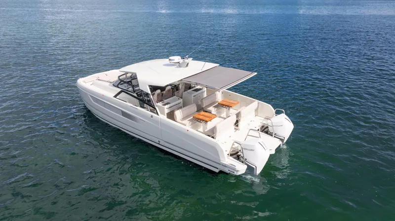  Yacht Photos Pics Modern 2025 YOT 36 boat on calm blue water, featuring spacious seating and sleek design.