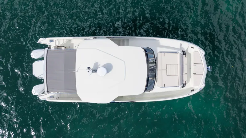  Yacht Photos Pics Aerial view of 2025 YOT 36 boat on clear blue water.