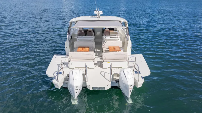  Yacht Photos Pics Luxury YOT 36 boat, 2025 model, on calm blue water, rear view.